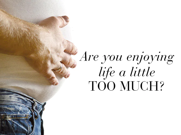 w_activeliver_overweight_man_with_hand_on_belly_de_700x520